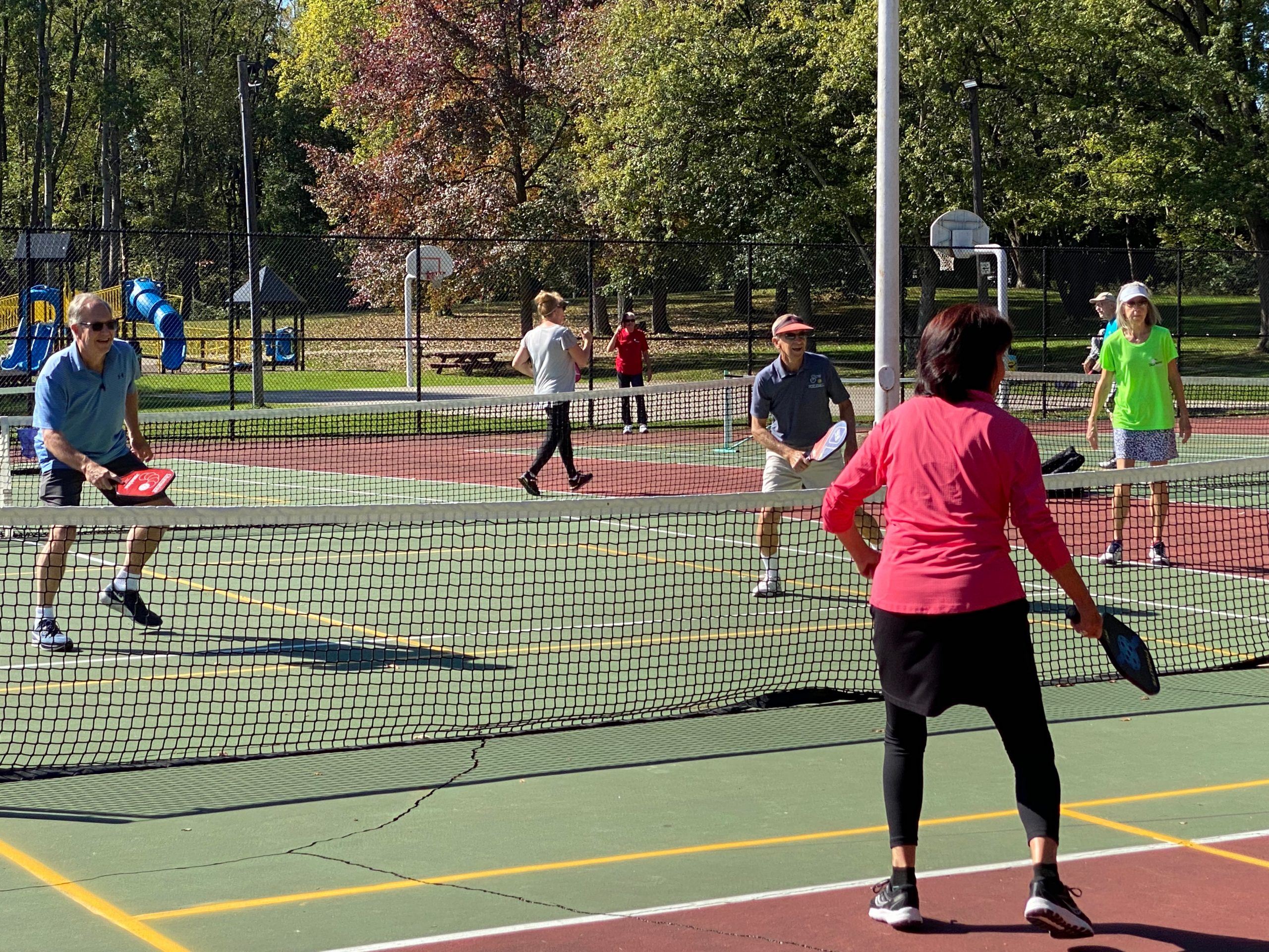 People on a Tennis Court